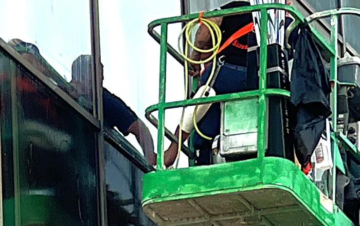 Pro Tint Orlando's Installers are installing Sun Control Solar Film on an Office Building in Orlando, FL