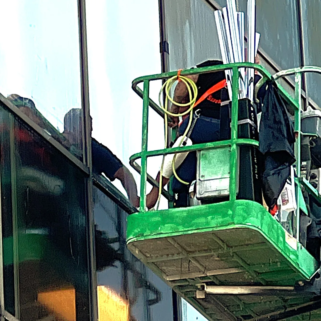 Pro Tint Orlando's Installers are installing Sun Control Solar Film on an Office Building in Orlando, FL